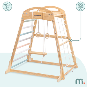 Trälekplats inomhus med gunga, gymnastikringar och klätternät